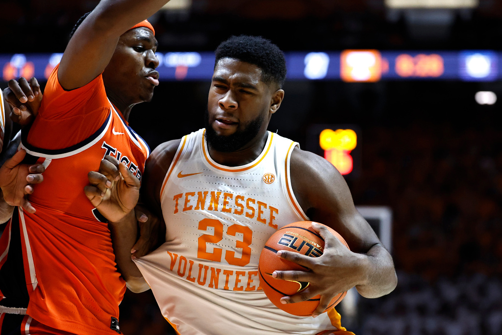 Tennessee forward Jaylen Carey (23) drives for a shot against Auburn forward Sebastian Williams-Adams, left, during the first half of an NCAA college basketball game Saturday, Jan. 31, 2026, in Knoxville, Tenn. (AP Photo/Wade Payne)