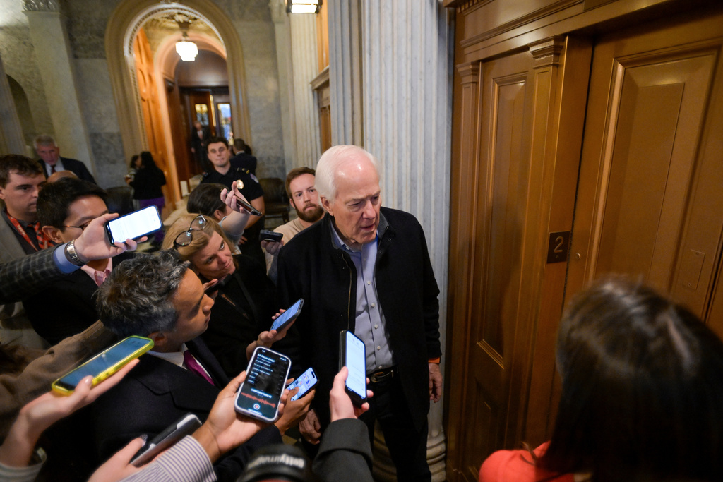 Sen. John Cornyn, R-Texas, talks with reporters as he leaves the Senate chamber during a Senate war powers vote on Iran on Capitol Hill, Wednesday, March 4, 2026, in Washington. (AP Photo/Rod Lamkey, Jr.)