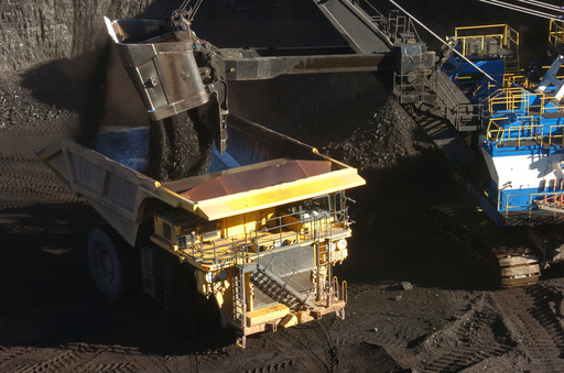 FILE - A mechanized shovel loads coal into a haul truck at a mine near Decker, Mont., on Nov. 15, 2016. (AP Photo/Matthew Brown, File) FILE - A mechanized shovel loads coal into a haul truck at a mine near Decker, Mont., on Nov. 15, 2016. (AP Photo/Matthew Brown, File)