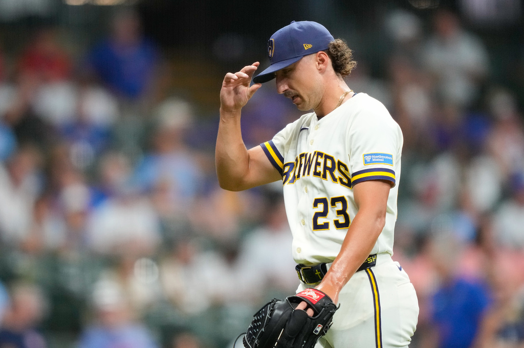 Milwaukee Brewers pitcher Brandon Sproat walks off the field after being taken out of the game during the ninth inning of a baseball game against the Chicago Cubs Wednesday, Sept. 9, 2026, in Milwaukee. (AP Photo/Kayla Wolf)