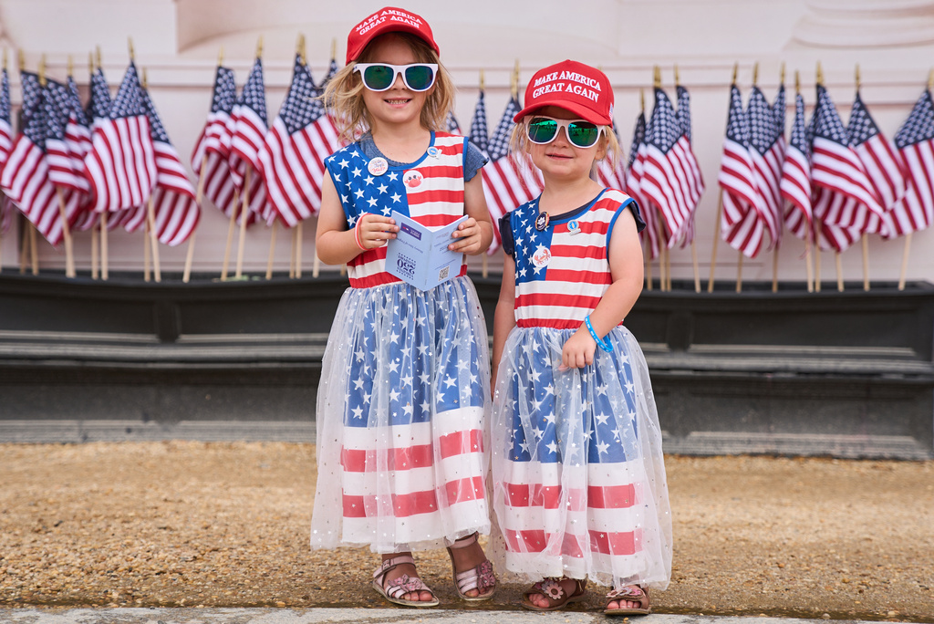 Mackenzie Looper, 4 and her sister Mikayla Looper, 3, of Rapid City, S.D., pose for a portrait while attending the Great American State Fair on the National Mall, Tuesday, July 7, 2026, in Washington. (AP Photo/Jacquelyn Martin)
