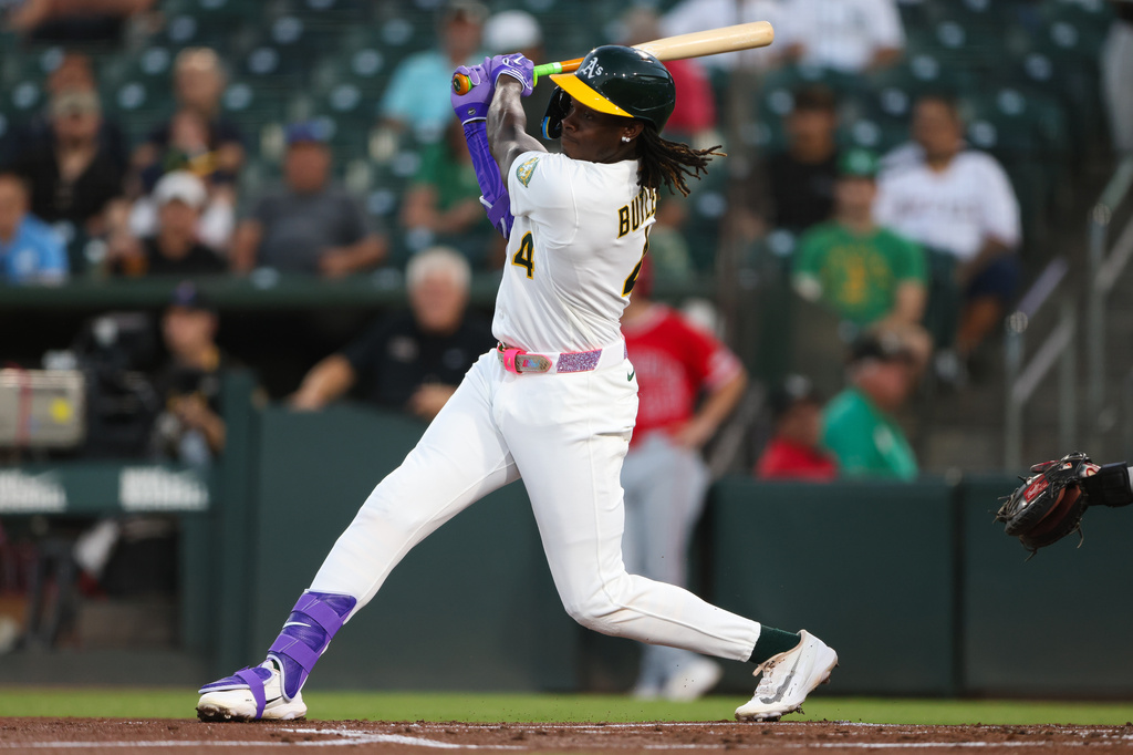 Athletics' Lawrence Butler hits an RBI single during the first inning of a baseball game against the Los Angeles Angels Wednesday, Sept. 23, 2026, in West Sacramento, Calif. (AP Photo/Scott Marshall)