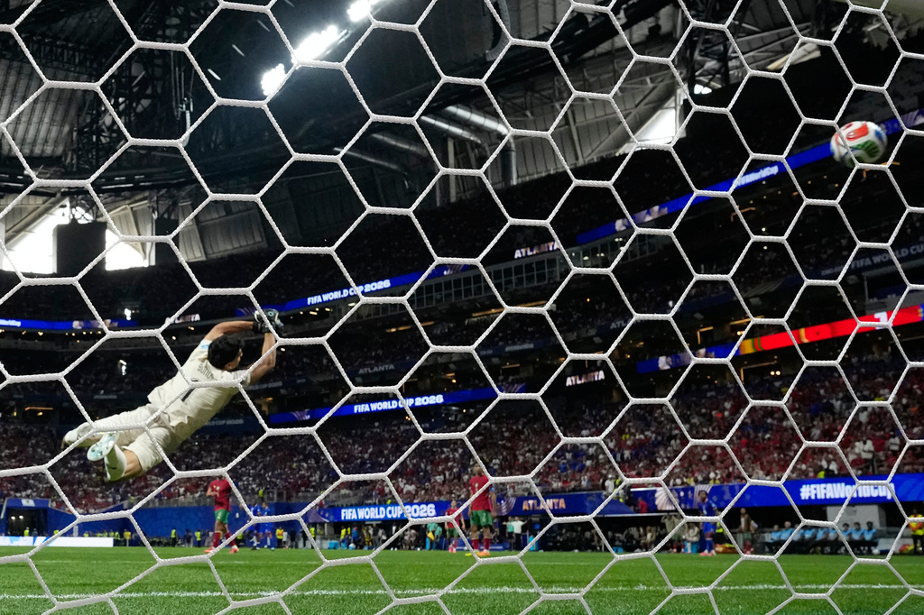 Morocco goalkeeper Yassine Bounou (1) is unable to stop a shot for goal by Haiti's Wilson Isidor (18) during the World Cup Group C soccer match between Morocco and Haiti in Atlanta, Wednesday, June 24, 2026. (AP Photo/Mike Stewart)