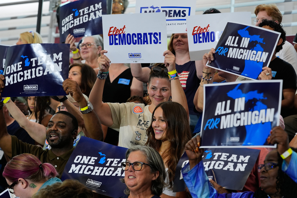 Supporters cheer at a Democratic General Election Kickoff Rally at Renaissance High School Friday, Aug. 7, 2026, in Detroit. (AP Photo/Paul Sancya)