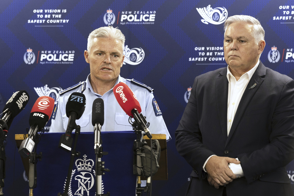 New Zealand Commissioner of Police Richard Chambers, left, and Police Minister Mark Mitchell address a press conference in Hamilton, New Zealand, Tuesday, Sept. 9, 2025. (Christel Yardley/Waikato Times via AP)