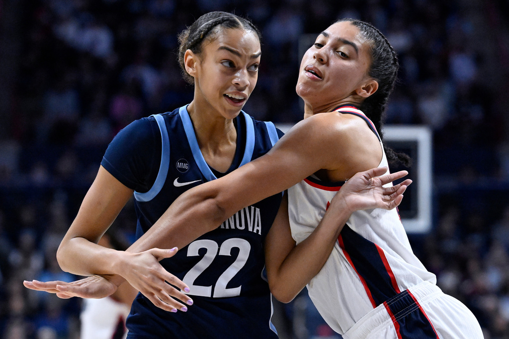 UConn guard Azzi Fudd, right, guards Villanova guard Kennedy Henry as she looks for an inbound pass in the first half of an NCAA college basketball game, Thursday, Jan. 15, 2026, in Storrs, Conn. (AP Photo/Jessica Hill)