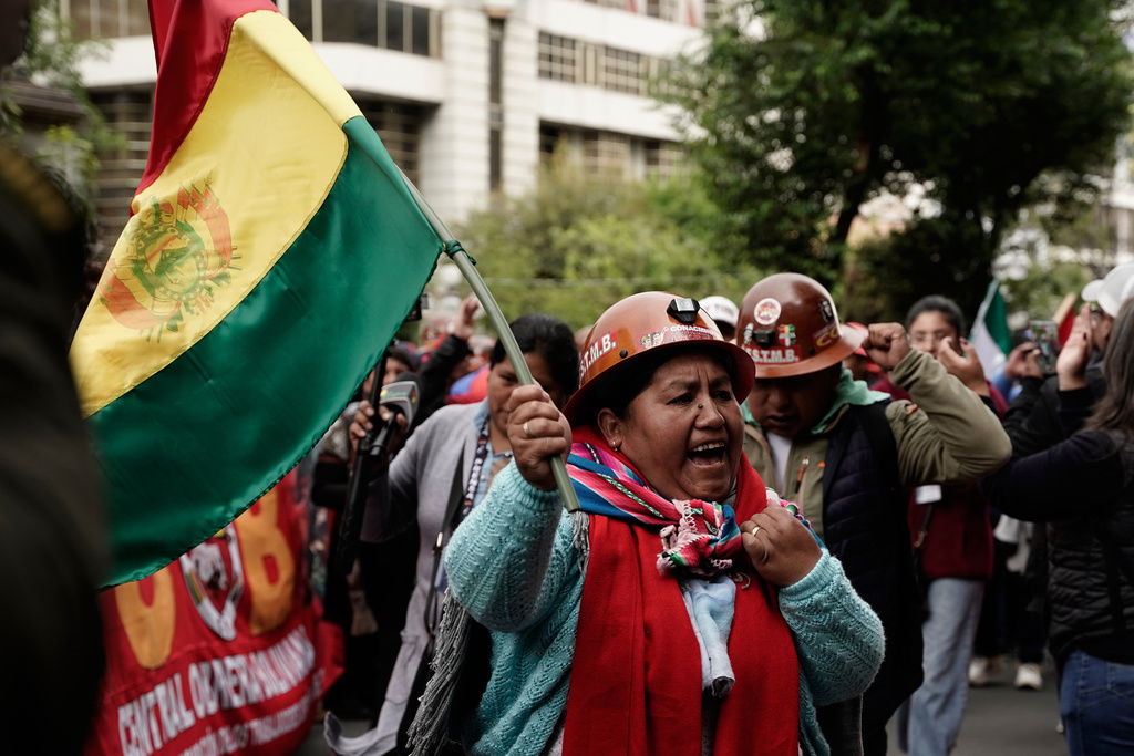 Miners march to protest President Rodrigo Paz's decision to remove fuel subsidies in La Paz, Bolivia, Monday, Dec. 29, 2025. (AP Photo/Freddy Barragan)