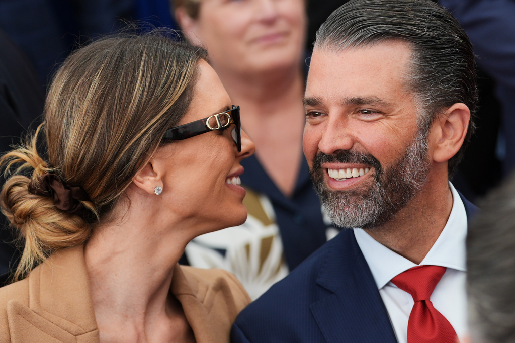 FILE - Donald Trump Jr., speaks with his wife Bettina, left, as they wait for President Donald Trump to deliver remarks to U.S. embassy staff at Deerfield Residence in Dublin, Sept. 12, 2026. (AP Photo/Julia Demaree Nikhinson, File)