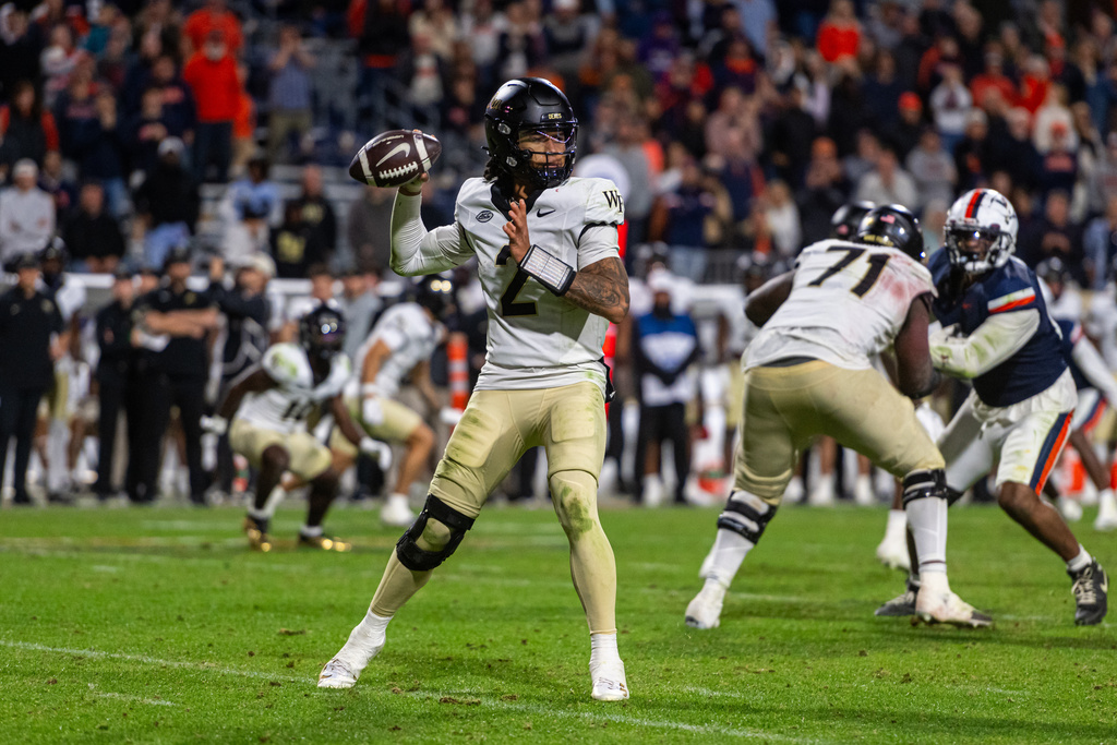 Virginia wide receiver Andre Greene Jr. (2) looks to throw during the second half of an NCAA college football game, Saturday, Oct. 4, 2025, in Charlottesville, Va. (AP Photo/Robert Simmons)