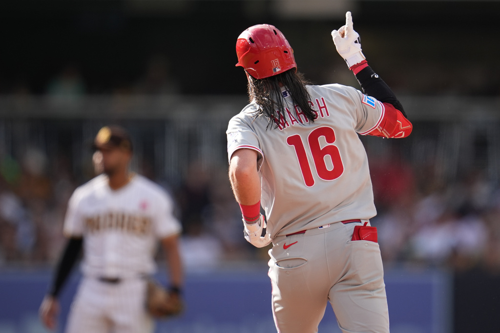 Philadelphia Phillies' Brandon Marsh celebrates after hitting a two-run home run during the seventh inning of a baseball game against the San Diego Padres Monday, May 25, 2026, in San Diego. (AP Photo/Gregory Bull)