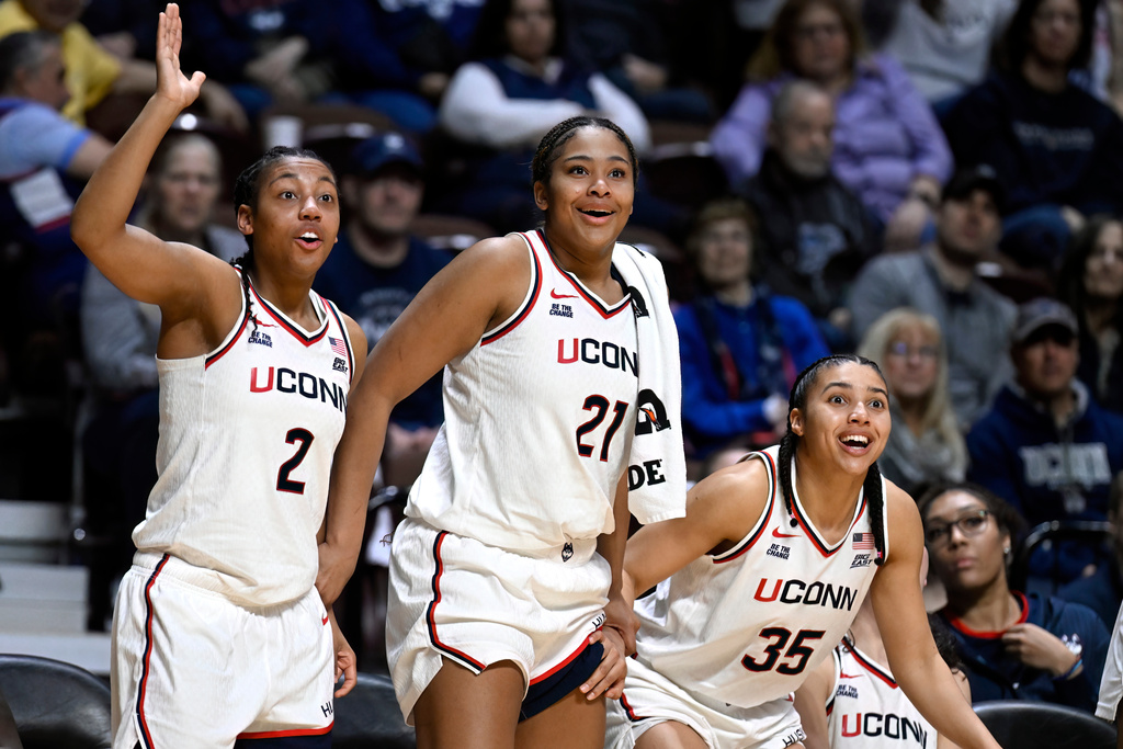 UConn guard KK Arnold (2), forward Sarah Strong (21) and guard Azzi Fudd (35) react from the bench during the second half of an NCAA college basketball game against Creighton in the semifinals of the Big East tournament, Sunday, March 8, 2026, in Uncasville, Conn. (AP Photo/Jessica Hill)
