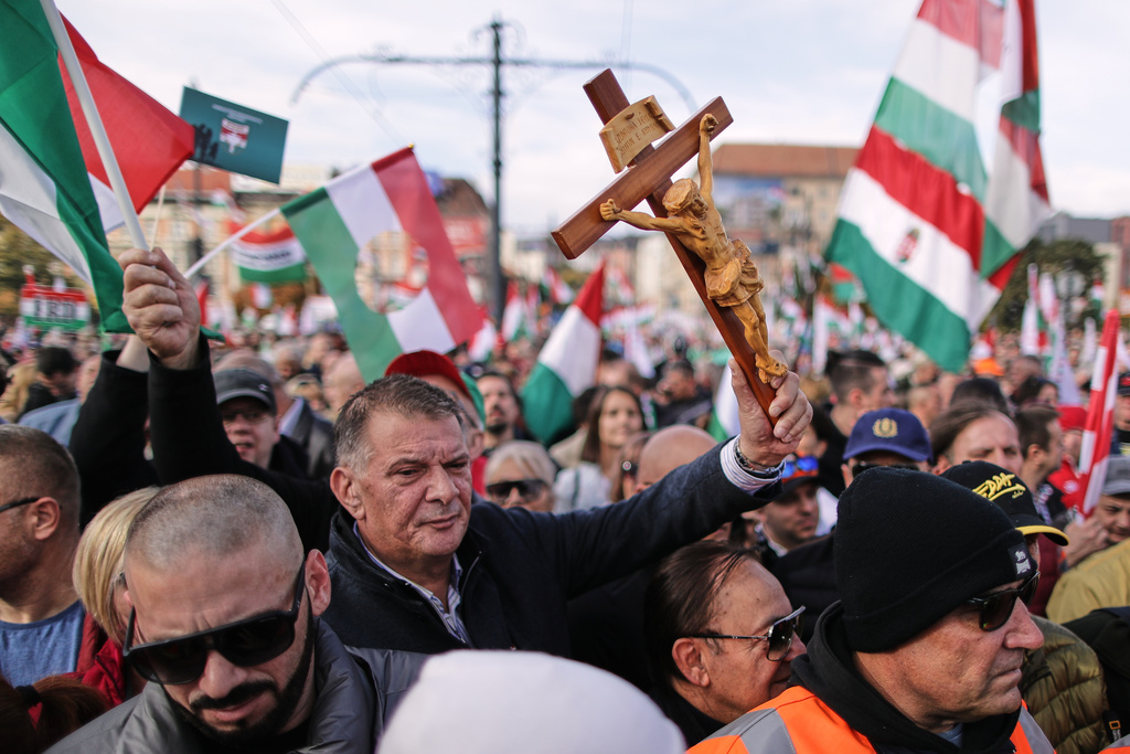 Pro-government demonstrators march during celebrations marking the 69th anniversary of the outbreak of Hungary's 1956 revolution against communist rule and the Soviet Union, in Budapest, Hungary, Thursday, Oct. 23, 2025. (AP Photo/Rudolf Karancsi)
