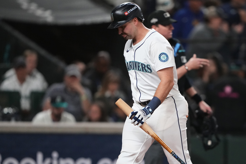 Seattle Mariners' Cal Raleigh reacts after popping out to Detroit Tigers third baseman Zach McKinstry during the 11th inning in Game 1 of baseball's American League Division Series, Saturday, Oct. 4, 2025, in Seattle. (AP Photo/Lindsey Wasson)