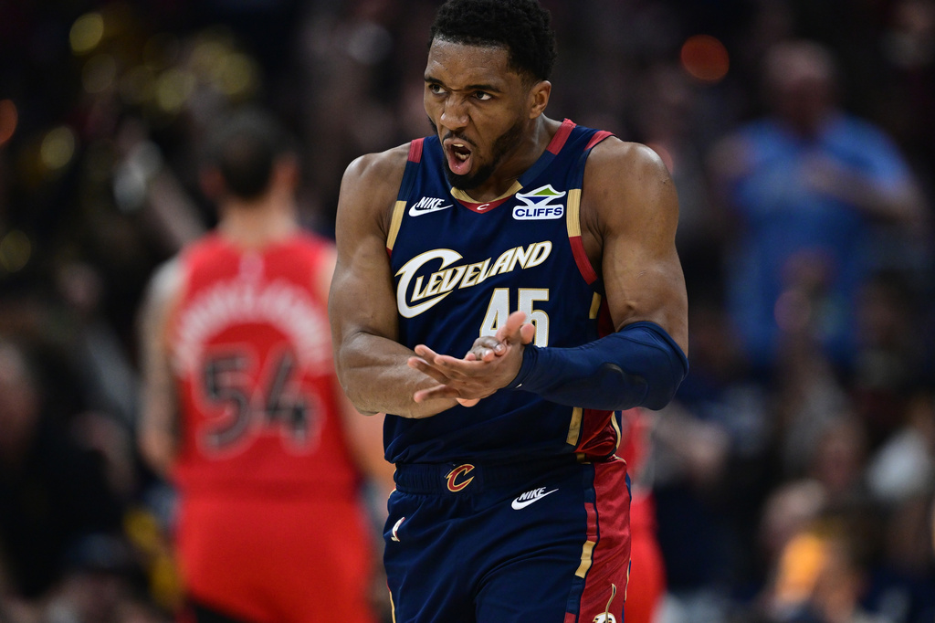 Cleveland Cavaliers guard Donovan Mitchell reacts after an assist during the first half in Game 1 of a first-round NBA playoffs basketball series against the Toronto Raptors, Saturday, April 18, 2026, In Cleveland. (AP Photo/David Dermer)