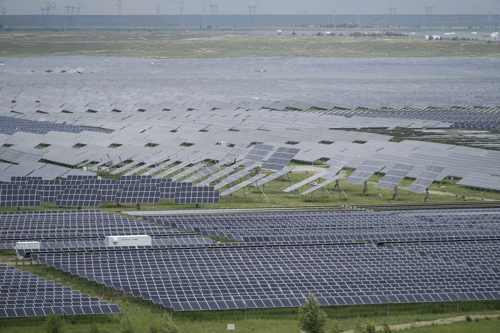 A solar farm is visible in Hainan prefecture of western China's Qinghai province on Tuesday, July 1, 2025. (AP Photo/Ng Han Guan)