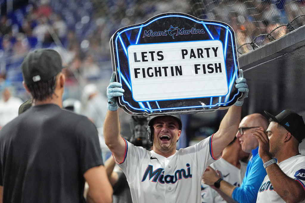Miami Marlins' Jakob Marsee celebrates after hitting a home run during the first inning of a baseball game against the St. Louis Cardinals, Tuesday, April 21, 2026, in Miami. (AP Photo/Rebecca Blackwell)