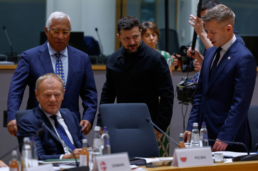 Ukraine's President Volodymyr Zelenskyy, second right, greets Hungary's Prime Minister Peter Magyar, right, next to European Council President Antonio Costa during a round table meeting at the EU summit in Brussels, Thursday, June 18, 2026. (AP Photo/Geert Vanden Wijngaert, Pool)