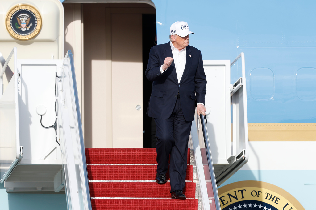 President Donald Trump walks down the stairs of Air Force One upon his arrival at Joint Base Andrews, Md., Friday, May 15, 2026. (AP Photo/Luis M. Alvarez)
