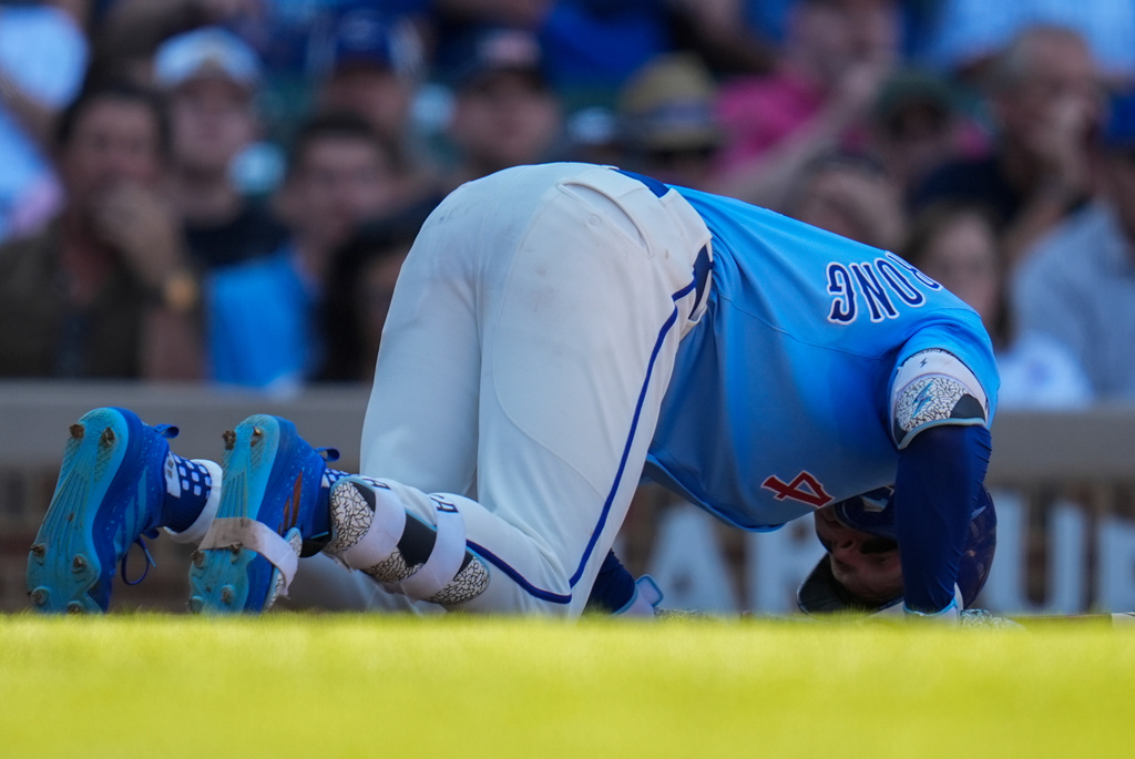 Chicago Cubs' Pete Crow-Armstrong (4) kneels on the ground after getting hit by a pitch from St. Louis Cardinals pitcher Chris Roycroft during the seventh inning of a baseball game Friday, Sept. 26, 2025, in Chicago. (AP Photo/Erin Hooley)