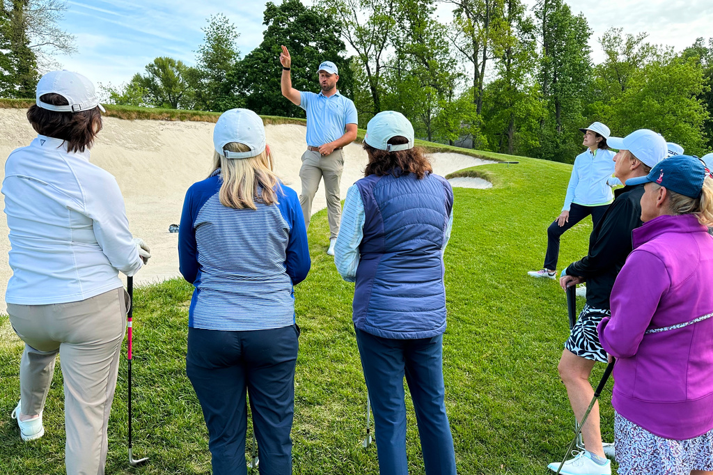 Braden Shattuck, a club professional who qualified to play in this weekend's PGA Championship at Aronimink Golf Club, instructs a golfers during a women's clinic at Rolling Green Golf Club, Wednesday, May 13, 2026, in Springfield, Pa. (AP Photo/Dan Gelston)