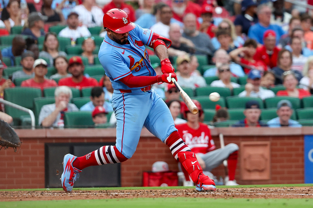 St. Louis Cardinals' Iván Herrera hits a two-RBI double during the sixth inning of a baseball game against the Cincinnati Reds Saturday, July 25, 2026, in St. Louis. (AP Photo/Scott Kane)