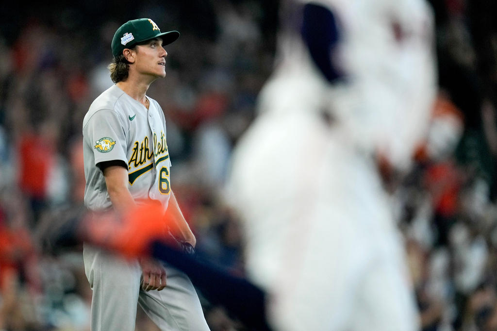 Athletics starting pitcher Kade Morris, left, watches a solo home run by Jose Altuve, right, during the third inning of a baseball game, Saturday, June 6, 2026, in Houston. (AP Photo/Eric Christian Smith)