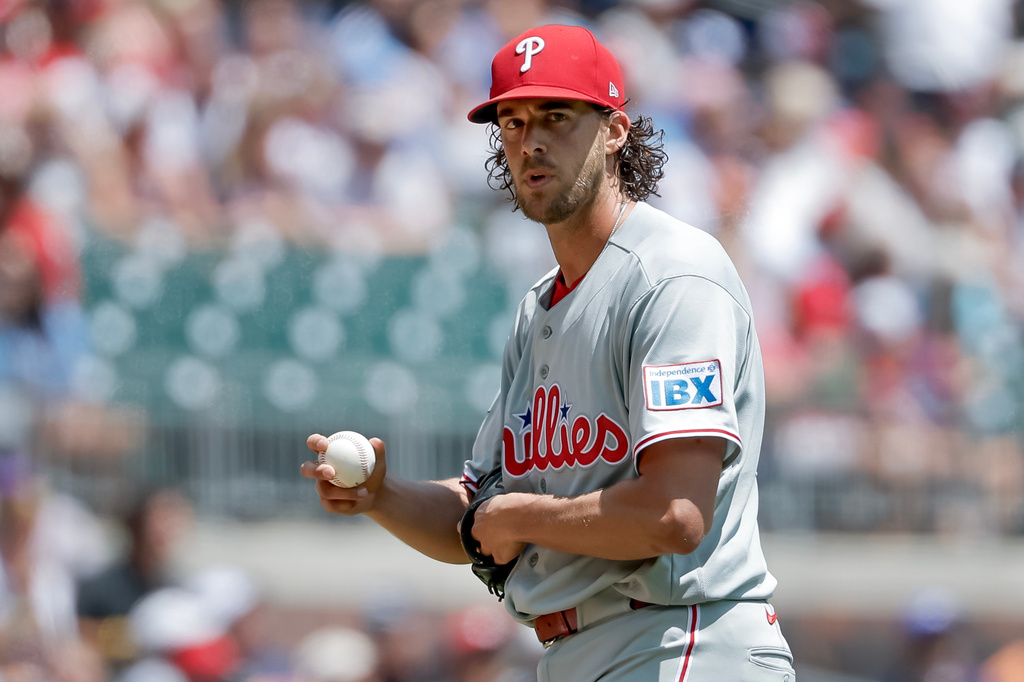 Philadelphia Phillies starting pitcher Aaron Nola (27) reacts after giving up a three-run home run to Atlanta Braves first baseman Matt Olson during the first inning of a baseball game, Sunday, April 26, 2026, in Atlanta. (AP Photo/Erik S. Lesser)