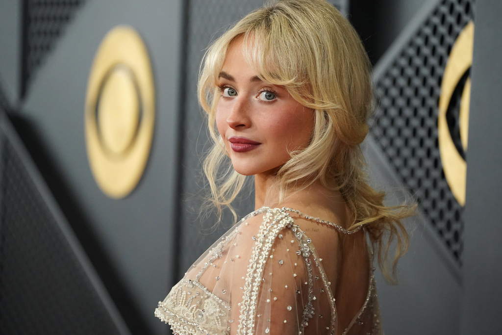 Sabrina Carpenter arrives at the 68th annual Grammy Awards on Sunday, Feb. 1, 2026, in Los Angeles. (Photo by Jordan Strauss/Invision/AP)