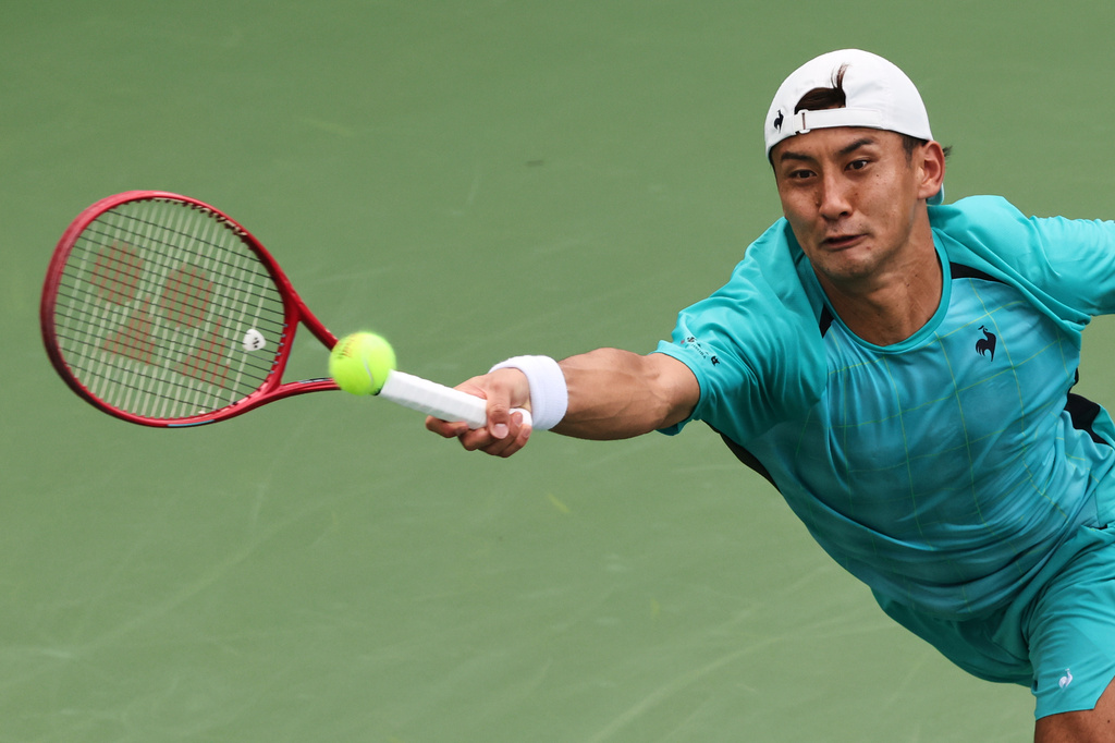 Sho Shimabukuro, of Japan, returns the ball to Arthur Rinderknech, of France, during the first round of the U.S. Open tennis championships, Sunday, Aug. 30, 2026, in New York. (AP Photo/Andres Kudacki)