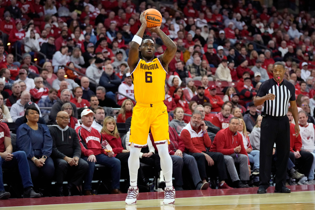 Minnesota guard Langston Reynolds (6) attempts a three-point basket during the first half of an NCAA college basketball game against Wisconsin Wednesday, Jan. 28, 2026, in Madison, Wis. (AP Photo/Kayla Wolf)