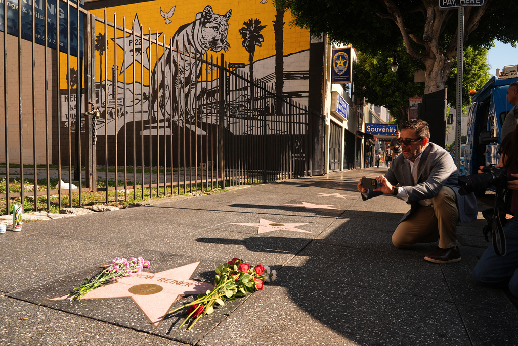 Flowers cover the Walk of Fame star for Rob Reiner Monday, Dec. 15, 2025, in the Hollywood section of Los Angeles. (AP Photo/Damian Dovarganes)