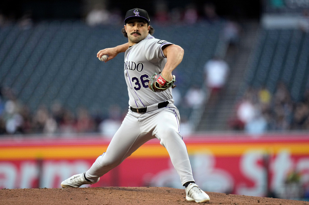 Colorado Rockies starting pitcher Zach Agnos throws against the Arizona Diamondbacks during the first inning of a baseball game, Thursday, May 21, 2026, in Phoenix. (AP Photo/Ross D. Franklin)