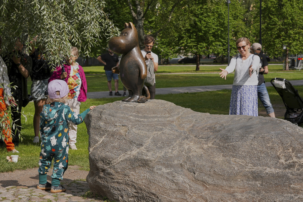 Finland Moomins Fans celebrate the 80th anniversary of the publication of the Finnish children's classic, "The Moomins and The Great Flood," and the birthday of the author Tove Jansson, in Tampere, Finland, Saturday, Aug. 9, 2025. (AP Photo/Tommi Ojala)