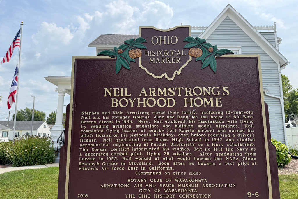 An Ohio historical landmark sign is displayed outside the former home of Neil Armstrong Friday, July 31, 2026, in Wapakoneta, Ohio. (AP Photo/Patrick Aftoora-Orsagos)