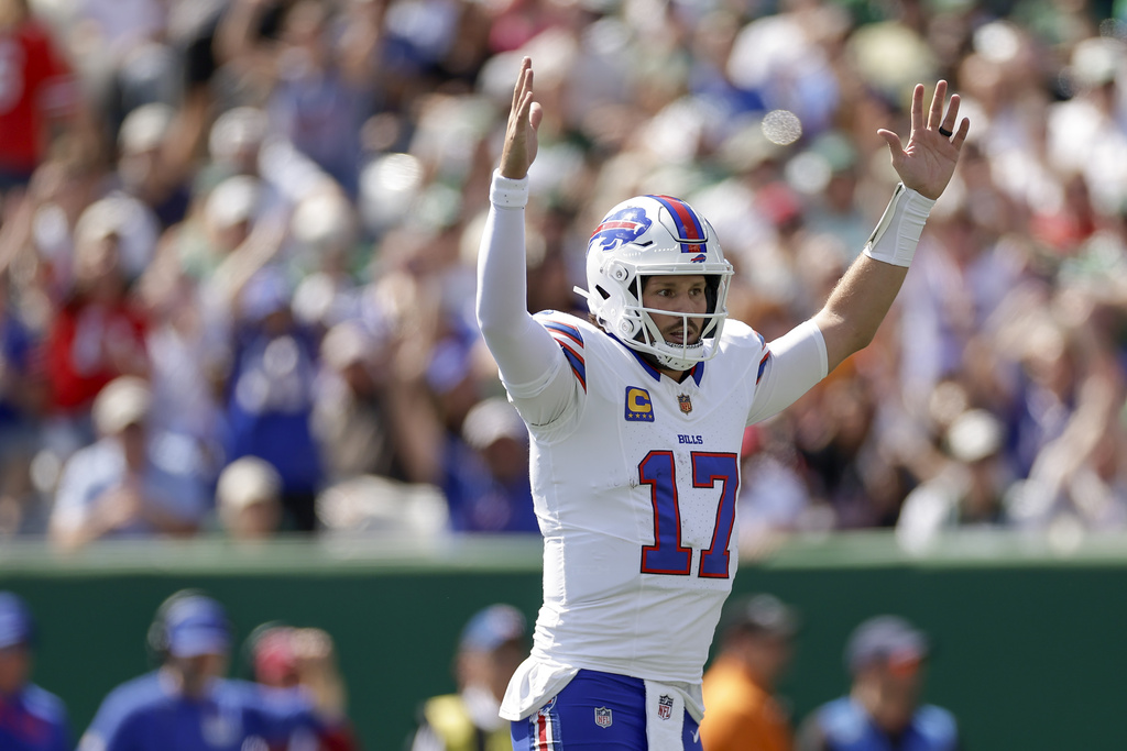 Buffalo Bills quarterback Josh Allen (17) reacts after a touchdown against the New York Jets during the first quarter of an NFL football game, Sunday, Sept. 14, 2025, in East Rutherford, N.J. (AP Photo/Adam Hunger)