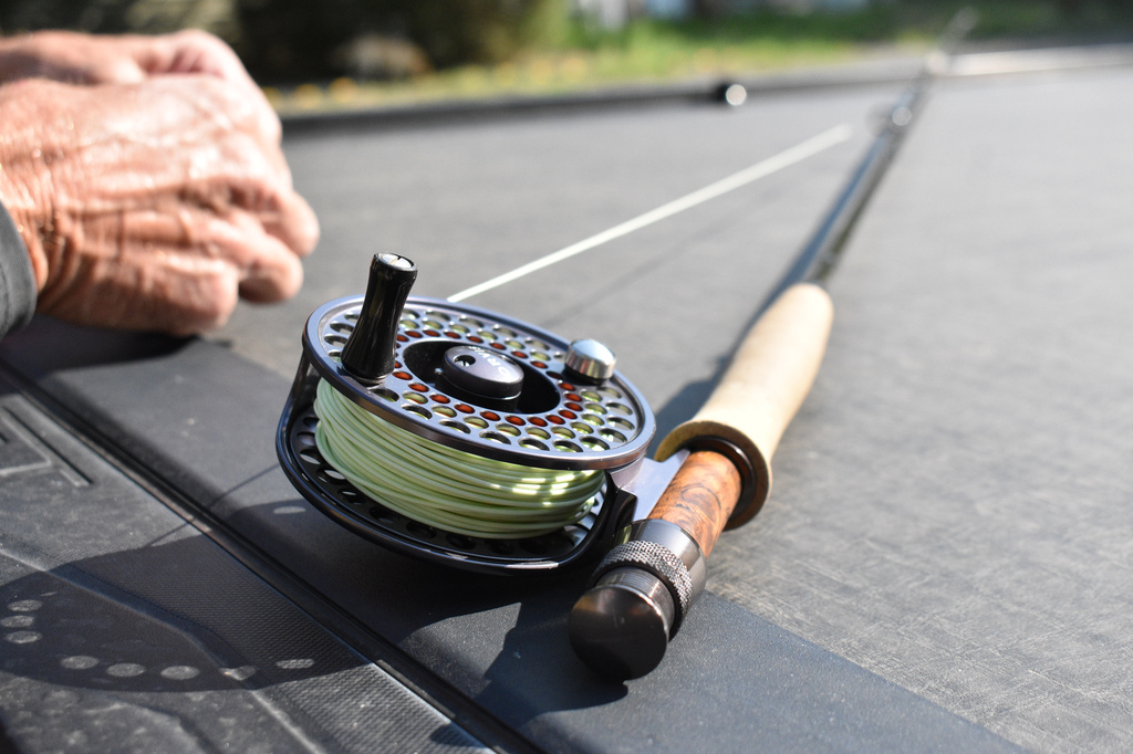A fly fishing rod is seen on the back of a truck near the Yellowstone River, July 31, 2026, near Livingston, Montana. (AP Photo/Matthew Brown)