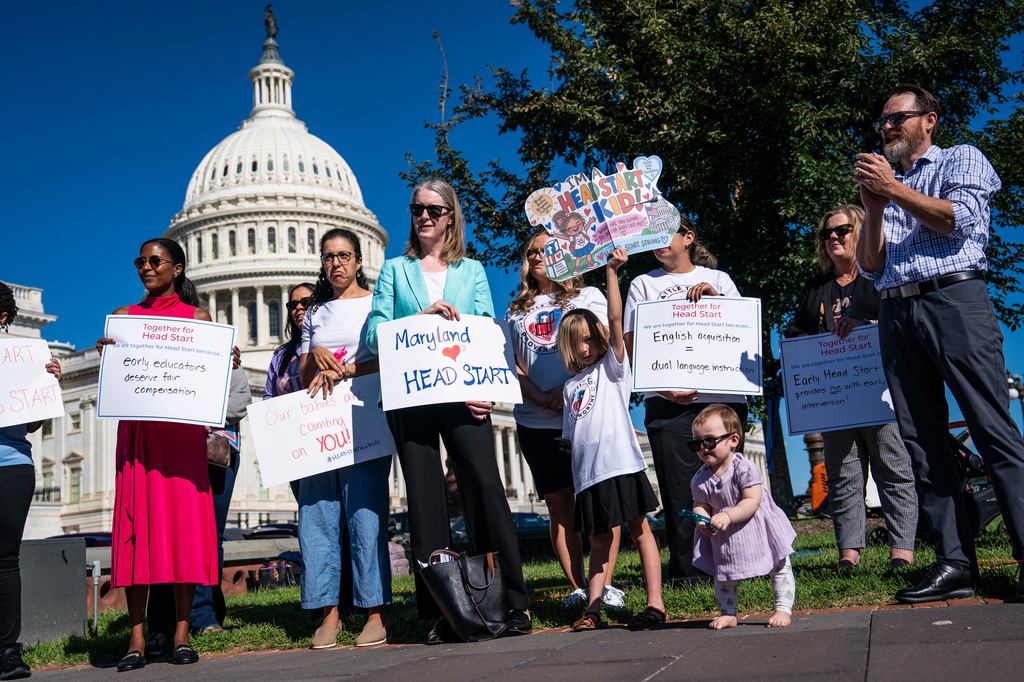 Members of Congress, parents and national child advocates hold signs and speak about the Trump Administration's proposed changes to the Head Start program at a news conference outside the Capitol, Tuesday, Sept. 15, 2026, in Washington. (AP Photo/Jabin Botsford)