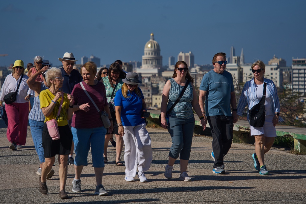 Tourist walk through Havana, Cuba, Thursday, Feb. 26, 2026. (AP Photo/Ramon Espinosa)