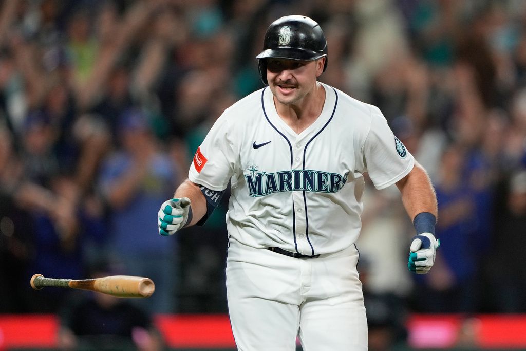 Seattle Mariners' Cal Raleigh reacts after hitting his 60th home run during the eighth inning of a baseball game against the Colorado Rockies, Wednesday, Sept. 24, 2025, in Seattle. (AP Photo/Ryan Sun)