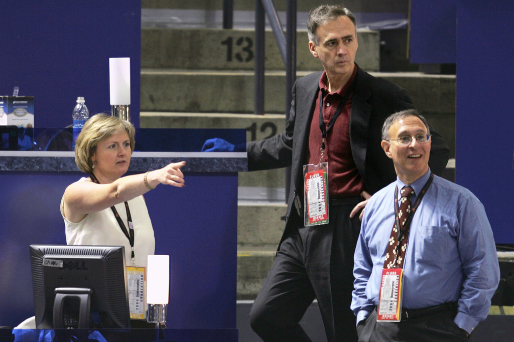 Washington Bureau Chief Sandy Johnson, left, AP President and CEO Tom Curley, center, and Managing Editor Mike Silverman, are seen in the press area looking out onto the convention floor at the FleetCenter in Boston during the 2004 Democratic National Convention. (AP Corporate Communications/Ron Edmonds)