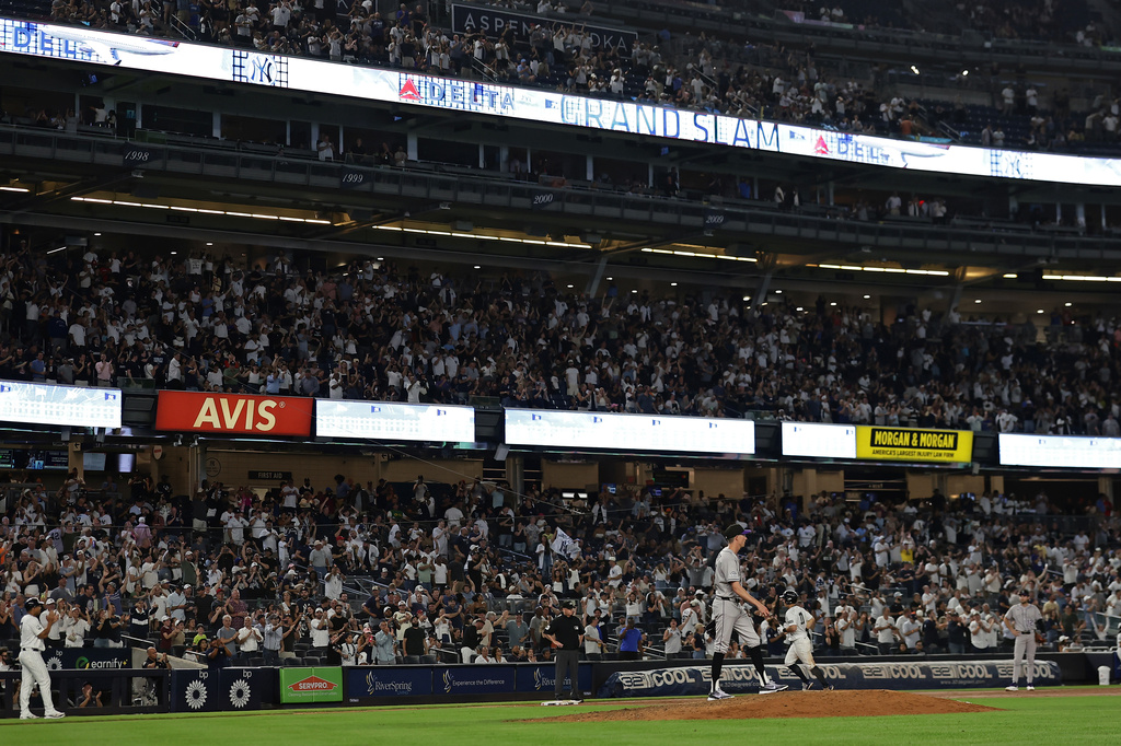 Colorado Rockies relief pitcher Jimmy Herget reacts after giving up a grand slam to New York Yankees' Anthony Volpe during the seventh inning of a baseball game Thursday, Sept. 10, 2026, in New York. (AP Photo/Adam Hunger)