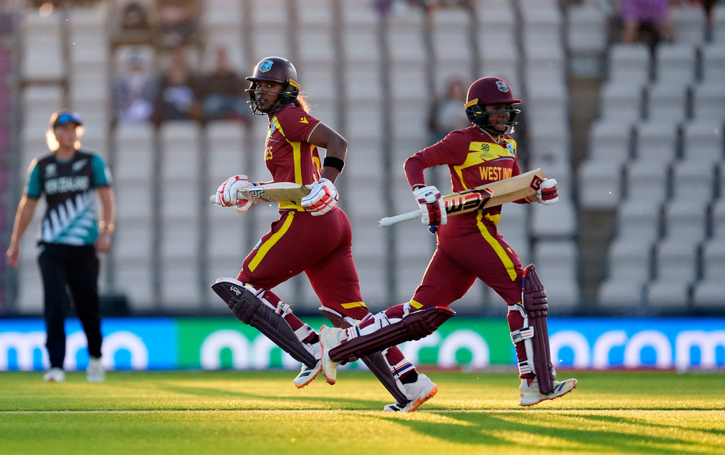 West Indies' Hayley Matthews, left, and Shemaine Campbelle run between the wickets during the Women's T20 World Cup match between New Zealand and West Indies in Southampton, England, Saturday June 13, 2026. (Andrew Matthews/PA via AP)