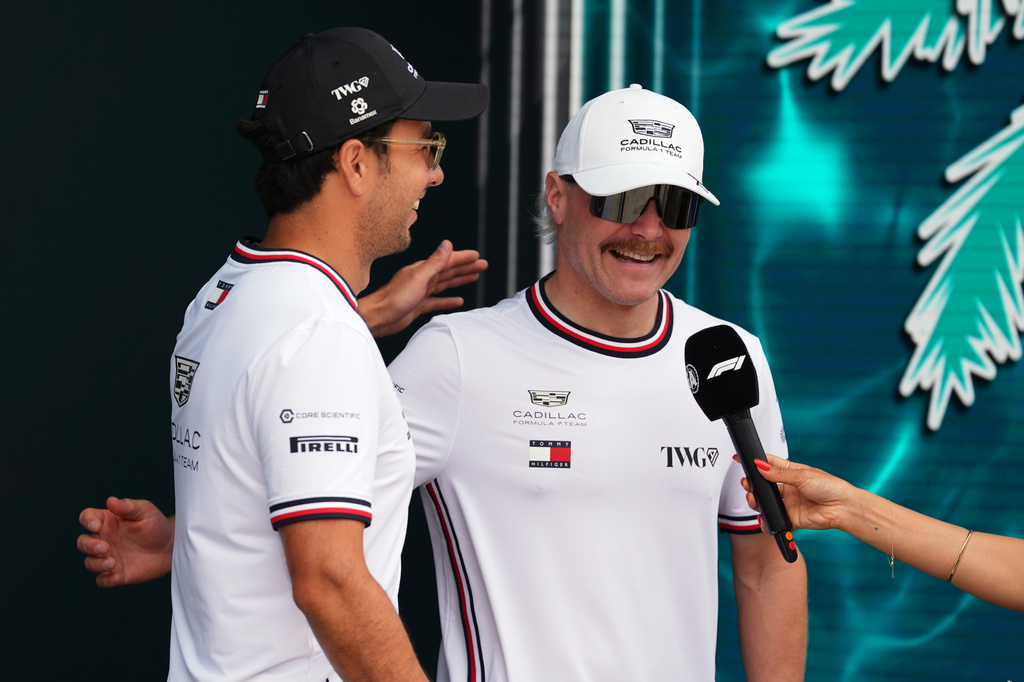 Cadillac driver Sergio Perez, left, of Mexico greets Cadillac driver Valtteri Bottas of Finland during the drivers' presentation ahead of the Miami Formula One Grand Prix auto race, Sunday, May 3, 2026, in Miami Gardens, Fla. (AP Photo/Rebecca Blackwell)