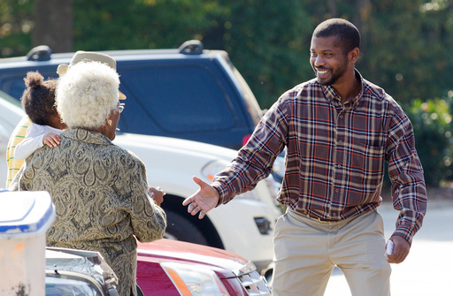 CORRECTS SOURCE TO NEWS&RECORD = N.C. House Rep. Cecil Brockman talks with early voters at Brown Recreation Center, on Wednesday, Nov. 2, 2016, in Greensboro, N.C. (Joseph Rodriguez/News & Record via AP) CORRECTS SOURCE TO NEWS&RECORD = N.C. House Rep. Cecil Brockman talks with early voters at Brown Recreation Center, on Wednesday, Nov. 2, 2016, in Greensboro, N.C. (Joseph Rodriguez/News & Record via AP)