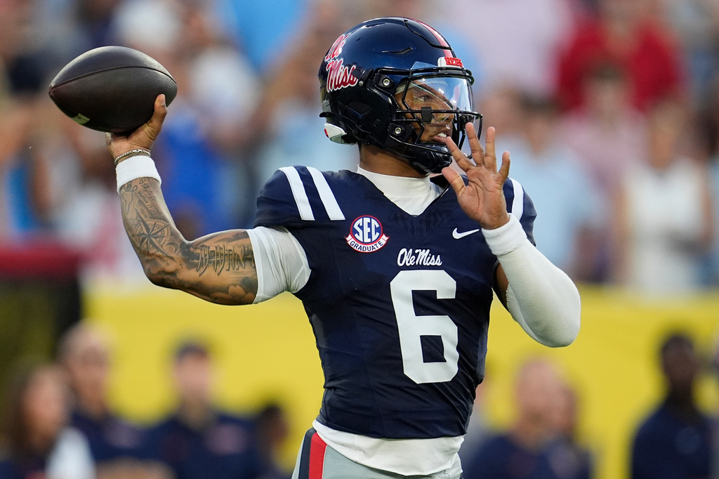 Mississippi quarterback Trinidad Chambliss (6) looks to throw a pass during the first half of an NCAA college football game against Louisville, Sunday, Sept. 6, 2026, in Nashville, Tenn. (AP Photo/George Walker IV)