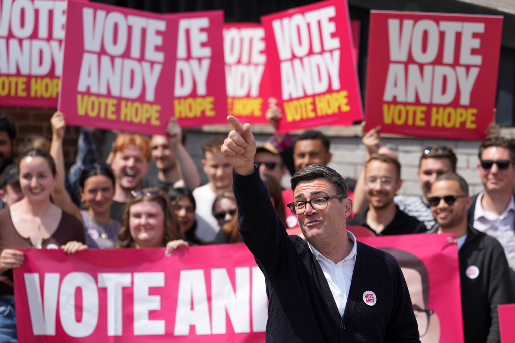 Andy Burnham, Britain's Labour candidate for Makerfield, gestures in front of supporters during the by-election in Makerfield, England, Thursday, June 18, 2026 where voters are choosing a new lawmaker with Andy Burnham of the Labour Party as the leading contender.(AP Photo/Jon Super)