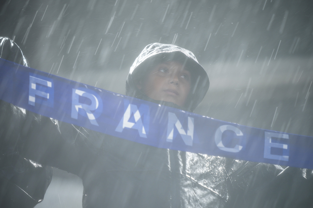 Fans of France reacts after a weather delay during the World Cup Group I soccer match between France and Iraq in Philadelphia, Monday, June 22, 2026. (AP Photo/Matt Rourke)