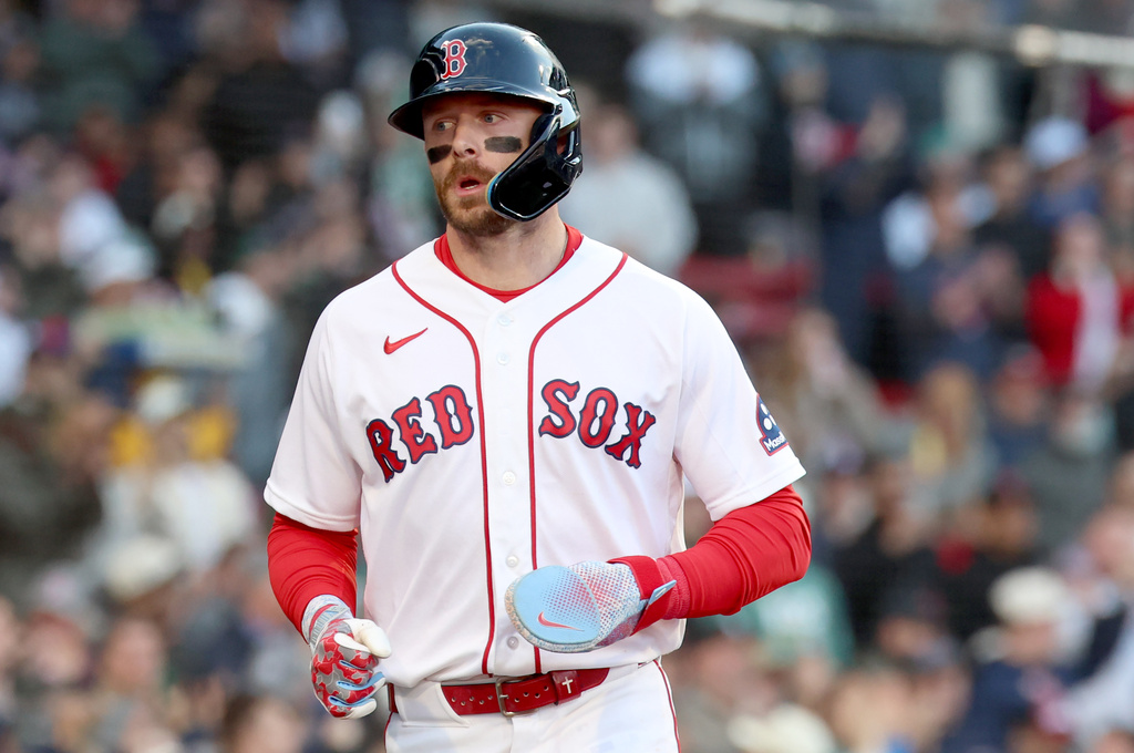 Boston Red Sox's Trevor Story runs to the dug out after scoring during the second inning of a baseball game against the New York Yankees, Thursday, April 23, 2026, in Boston. (AP Photo/Mark Stockwell)