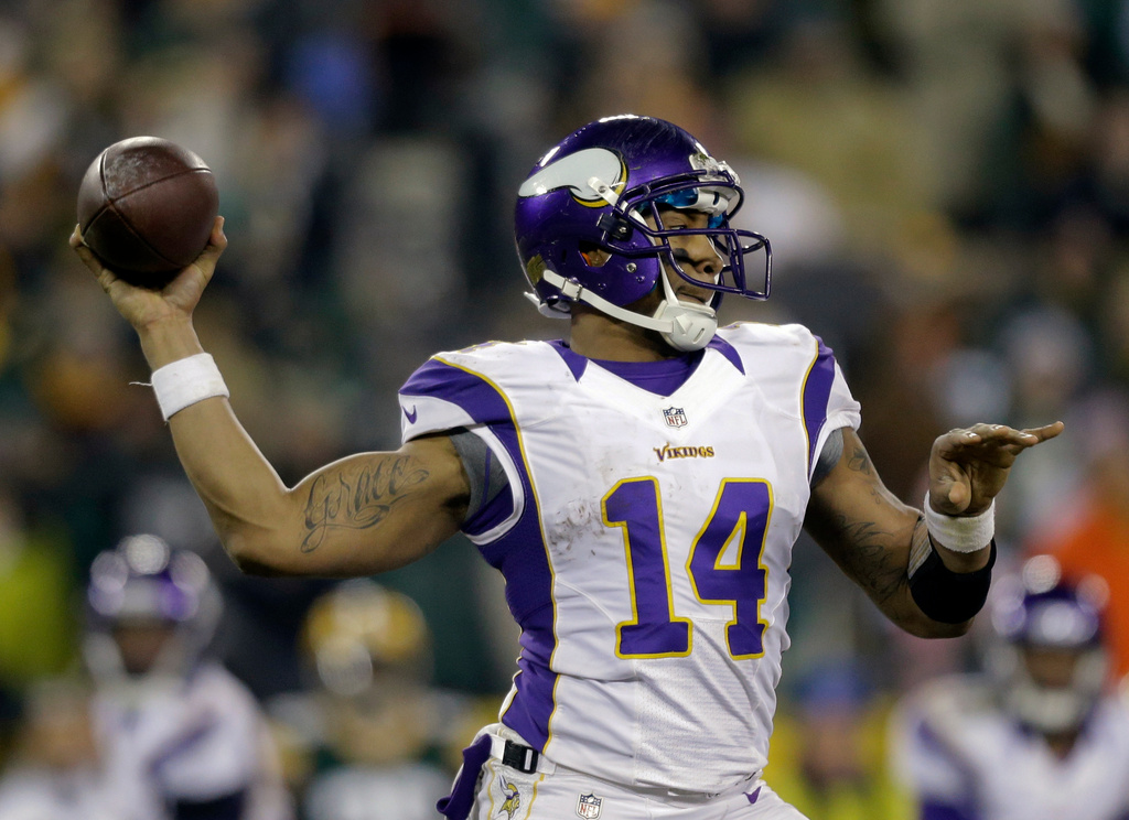 FILE - Minnesota Vikings quarterback Joe Webb (14) throws a pass during the second half of an NFL wild card playoff football game against the Green Bay Packers Jan. 5, 2013, in Green Bay, Wis. (AP Photo/Jeffrey Phelps, File)