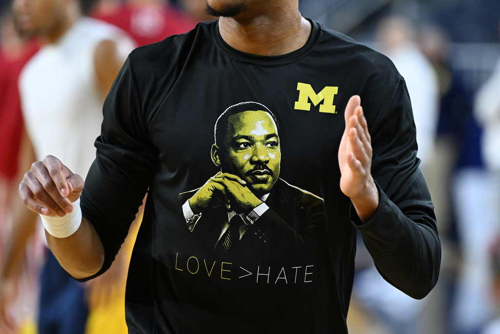 Michigan basketball players wearing special shirts for MLK Day while warming up before their NCAA college basketball game against Indiana, Tuesday, Jan. 20, 2026, in Ann Arbor, Mich.,(AP Photo/Lon Horwedel)